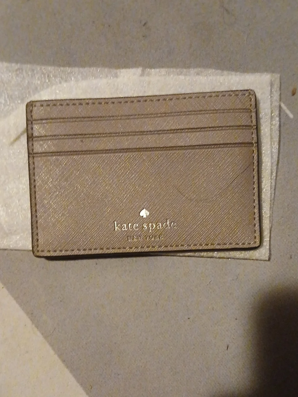 kate spade taupe leather card case with gold logo